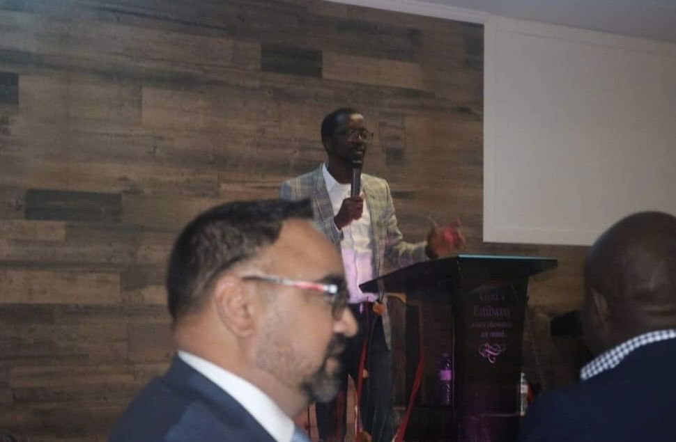 A presenter addressing the room
